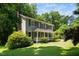 An eye-level view of this beautiful two story home, surrounded by mature trees at 1006 Apache Ln, Apex, NC 27502