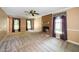 Spacious living room featuring a fireplace, neutral carpet, and ample natural light at 1006 Apache Ln, Apex, NC 27502