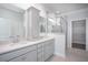 Luxurious bathroom featuring double sinks, granite countertops, a walk-in shower, and an adjoining closet at 1041 Bonanza Ln # 37, Mebane, NC 27302