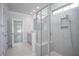 Modern bathroom with walk-in shower, tiled walls, and separate vanity area for enhanced functionality at 1041 Bonanza Ln # 37, Mebane, NC 27302