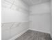 Walk-in closet with wire shelving, providing ample storage space for an organized wardrobe at 1041 Bonanza Ln # 37, Mebane, NC 27302