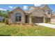 Charming brick home featuring an attached two-car garage and well-manicured lawn at 1041 Bonanza Ln # 37, Mebane, NC 27302