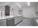 Bright kitchen showcasing an island with a sink and granite countertops, and a fireplace for a cozy feel at 1041 Bonanza Ln # 37, Mebane, NC 27302