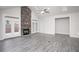 Bright living room features a stunning stone fireplace, high ceilings, and ample space at 1041 Bonanza Ln # 37, Mebane, NC 27302