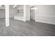 Open-concept living area boasts hard surface flooring, white trim, and ample natural light at 1041 Bonanza Ln # 37, Mebane, NC 27302