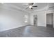 Spacious bedroom with new flooring, a tray ceiling with fan, and an ensuite bathroom for added convenience at 1041 Bonanza Ln # 37, Mebane, NC 27302