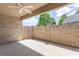 Covered patio featuring a ceiling fan and a brick fence with a wooden gate at 1041 Bonanza Ln # 37, Mebane, NC 27302