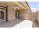 Covered patio featuring a ceiling fan, brick walls, and a concrete floor at 1041 Bonanza Ln # 37, Mebane, NC 27302