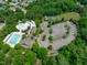 Aerial view of community amenities, including a pool, playground, parking, and recreational field at 105 Bridgegate Dr, Cary, NC 27519