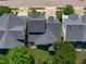 Aerial view of a home with a backyard featuring an artificial turf lawn and a charming patio area at 105 Bridgegate Dr, Cary, NC 27519