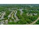 Aerial view showing a neighborhood and lake, showcasing the community's proximity to the water at 105 Bridgegate Dr, Cary, NC 27519