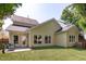 Beautiful backyard featuring a well-maintained lawn and a cozy covered patio at 105 Bridgegate Dr, Cary, NC 27519