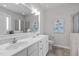 Bright bathroom featuring double sinks, tile floors and a large mirror at 105 Bridgegate Dr, Cary, NC 27519
