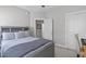 Comfortable bedroom with a gray bed frame, soft carpet, and neutral decor at 105 Bridgegate Dr, Cary, NC 27519