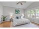 Serene bedroom with a large window, vaulted ceiling, neutral colors, and stylish furnishings at 105 Bridgegate Dr, Cary, NC 27519