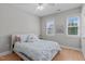 Bedroom with hardwood floors, neutral decor and a large window at 105 Bridgegate Dr, Cary, NC 27519