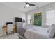 Cozy bedroom featuring a ceiling fan, dresser, and a charming school spirit flag at 105 Bridgegate Dr, Cary, NC 27519