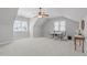 Spacious bonus room with neutral paint, bright windows and ample room for activities at 105 Bridgegate Dr, Cary, NC 27519