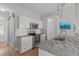 Bright kitchen featuring stainless steel appliances, stone countertops and hardwood floors at 105 Bridgegate Dr, Cary, NC 27519