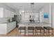 Spacious kitchen with granite countertops, stainless steel appliances, and a large central island at 105 Bridgegate Dr, Cary, NC 27519