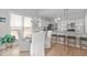 Bright kitchen and dining area featuring hardwood floors and neutral decor at 105 Bridgegate Dr, Cary, NC 27519