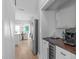 Modern kitchen featuring stainless steel refrigerator, wine cooler, and coffee bar with wood countertop at 105 Bridgegate Dr, Cary, NC 27519