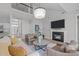Cozy living room with high ceilings, fireplace, comfortable seating, and modern decor at 105 Bridgegate Dr, Cary, NC 27519