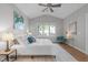 Bedroom with hardwood floors, neutral decor, and a large window at 105 Bridgegate Dr, Cary, NC 27519