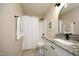 Bright bathroom with granite countertop vanity and a shower with a white curtain at 105 Old Dock Trl, Cary, NC 27519