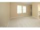 Comfortable bedroom featuring neutral carpet and large window at 105 Old Dock Trl, Cary, NC 27519