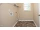Functional laundry room with utility connections, overhead rack, and window at 105 Old Dock Trl, Cary, NC 27519