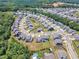 Expansive aerial view of the residential neighborhood with lush landscaping at 109 Crested Coral Dr, Holly Springs, NC 27540