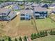 Aerial shot of the property highlighting the backyard and neighborhood layout at 109 Crested Coral Dr, Holly Springs, NC 27540