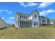 Picture of the backyard showing off the screened porch and outdoor space at 109 Crested Coral Dr, Holly Springs, NC 27540