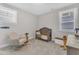 Bedroom with soothing gray walls, rocking chair, wooden crib, and nautical decor at 109 Crested Coral Dr, Holly Springs, NC 27540