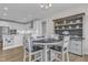 Eat-in kitchen features a round table with four chairs, seamlessly connected to the modern kitchen and a built-in hutch at 109 Crested Coral Dr, Holly Springs, NC 27540