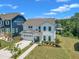 Charming two-story white home featuring a two-car garage and landscaped front yard at 109 Crested Coral Dr, Holly Springs, NC 27540