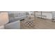 Cozy living room with comfortable seating, hardwood floors, and stylish decor at 109 Crested Coral Dr, Holly Springs, NC 27540