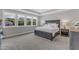 Spacious main bedroom with large windows, natural light, and tray ceiling at 109 Crested Coral Dr, Holly Springs, NC 27540