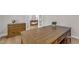 Spacious office featuring a wooden desk, drawers, and a view to the foyer at 109 Crested Coral Dr, Holly Springs, NC 27540