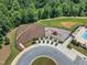 Aerial view of the playground and tanning beds area nestled by the community pool at 109 Crested Coral Dr, Holly Springs, NC 27540