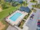 Inviting aerial view of community pool, complete with ample seating and a shaded pool house at 109 Crested Coral Dr, Holly Springs, NC 27540
