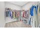 Walk-in closet with organized clothing racks and shelves, offering ample storage space at 109 Crested Coral Dr, Holly Springs, NC 27540