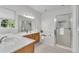 Bathroom with a double sink vanity, a soaking tub, and a glass-enclosed shower at 111 Ferncroft Ct, Cary, NC 27519