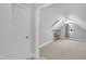 Finished attic bedroom with built-in shelves, carpet floors, ceiling fan, and dormer window at 111 Ferncroft Ct, Cary, NC 27519