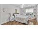 Inviting bedroom features wood floors, a large window, and neutral decor at 111 Ferncroft Ct, Cary, NC 27519