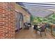 Deck with seating area, awning, and brick exterior, perfect for outdoor entertaining at 111 Ferncroft Ct, Cary, NC 27519