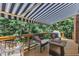 Shaded deck with awning, overlooking lush trees and green foliage at 111 Ferncroft Ct, Cary, NC 27519