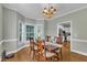 Charming dining room with wood floors and large bay windows for natural light at 111 Ferncroft Ct, Cary, NC 27519