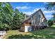 House exterior showing deck, siding, chimney, and well-manicured lawn at 111 Ferncroft Ct, Cary, NC 27519